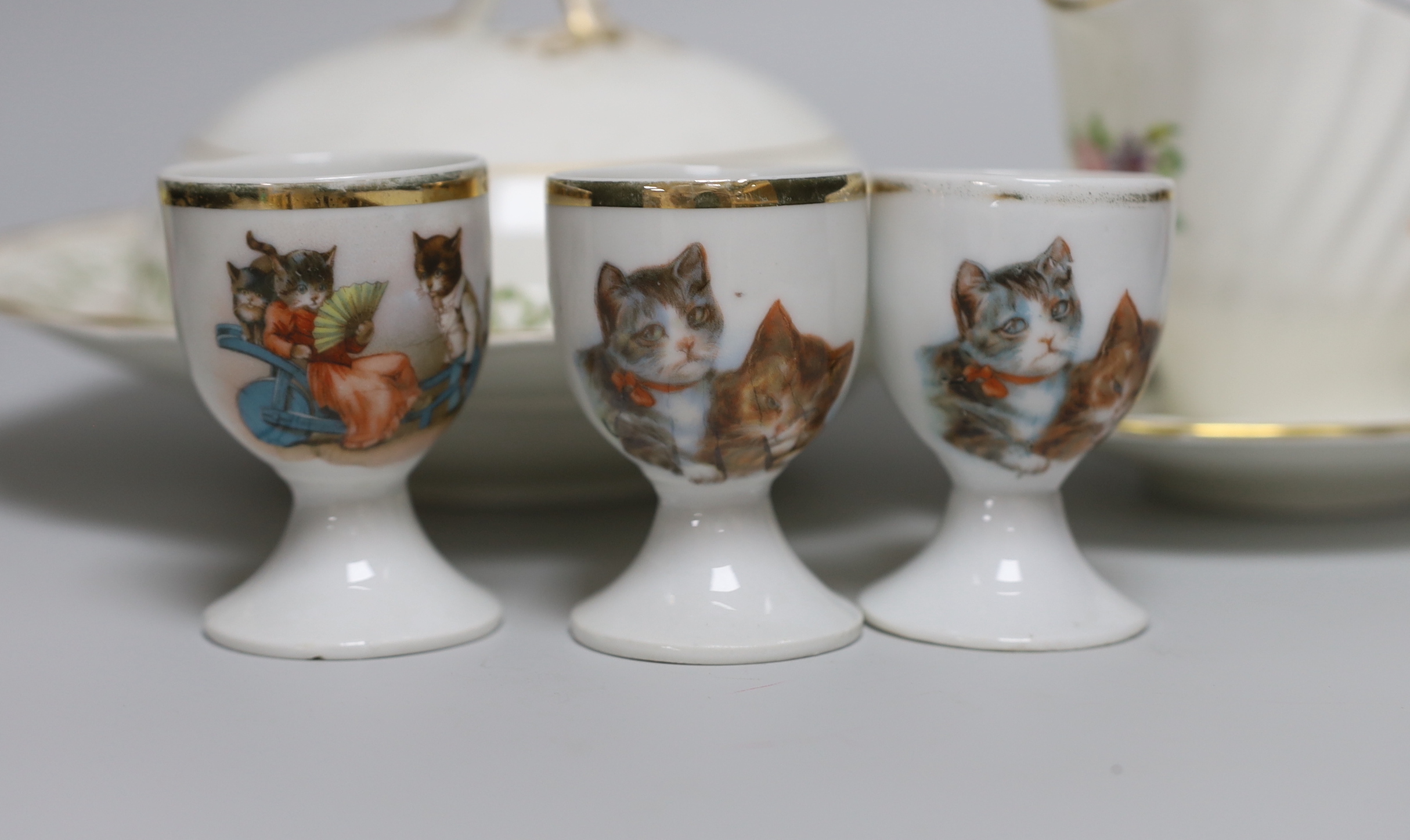 A Laura Knight Burleigh Ware mug and other mixed ceramics to include a Minton sauceboat, Crescent China dish and cover, a pair of Herend style vases and covers and three ‘cat’ decorated egg cups, tallest 14cm
